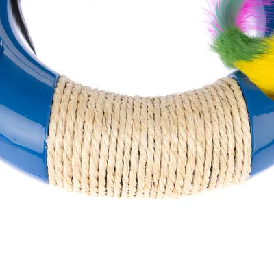 Toy ring made of blue plastic with sisal rope and colourful feathers.