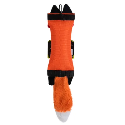 Jouet pour chien en forme d’animal, corps en tissu orange avec extrémités noires et queue en peluche orange à bout blanc. Étiquette visible à l’arrière.
