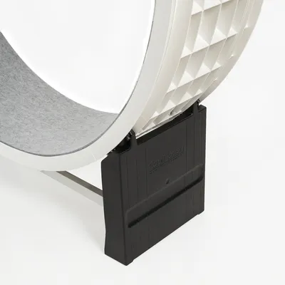 Close-up of a white exercise wheel with grey running surface and black base, embossed with 'Cat in Motion'.