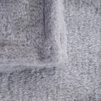 Close-up of grey, soft fabric with fluffy texture, suitable for pet beds or blankets.