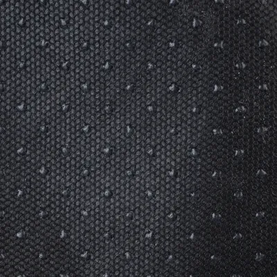 Close-up of a black, non-slip fabric with small bumps.