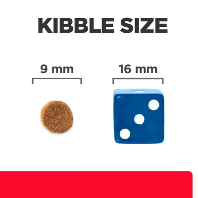 Сравнение на размер: гранула с диаметър 9 мм до син зар с размер 16 мм. Надпис: Kibble size.