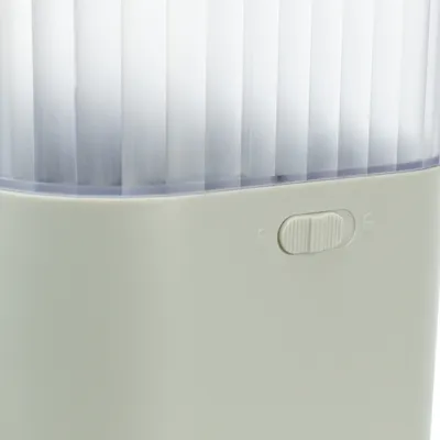 Close-up of a white container with a transparent lid and a sliding control positioned between two lock symbols.