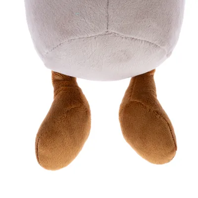 Pattes en peluche marron attachées à un corps rond en tissu beige, partie d’un jouet pour animaux visible sur l’image.