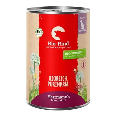 Blik Herrmann's Manufaktur Bio-Rind met Bio-Karotte, purinarm. Tekst: BIOREICH. PURINARM., BIO-PIONIER bij diervoeding. Bio-certificaat zichtbaar op het etiket.