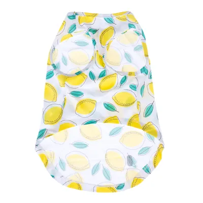Vêtement pour animal en tissu blanc avec motifs citrons jaunes et feuilles vertes, ouvertures pour les pattes visibles. Aucun texte ou marque apparente.