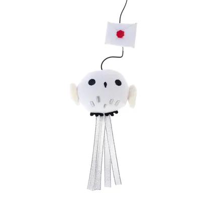 Fabric toy in the shape of a white owl with black eyes and silver ribbons, attached to a fabric letter with a red seal.