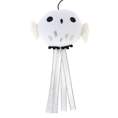 White plush toy in owl shape with black eyes, silver stripes and hanging ribbons. Suitable as cat toy.