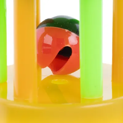 Toy with yellow base, green and orange rods, and a red-green ball inside.