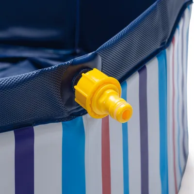 Close-up of a yellow drain valve on a blue and white striped plastic pool edge.