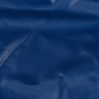 Close-up of a blue, textured surface with a fine diamond pattern.