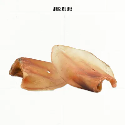 Two dried pig ears from George and Bobs, natural chew treats for pets.