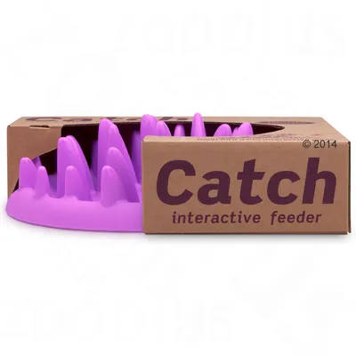 Catch comedero interactivo, cuenco lila con picos elevados, envase de cartón visible.