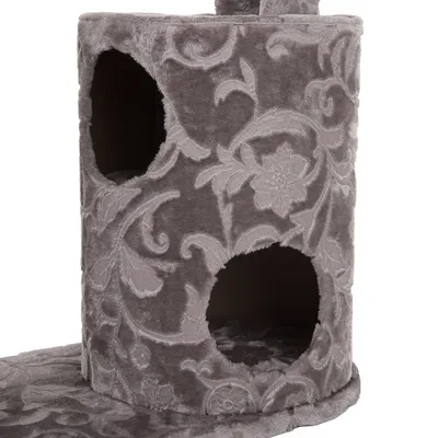 Arbre à chat cylindrique recouvert de tissu gris à motif floral, avec deux ouvertures rondes visibles sur le côté.