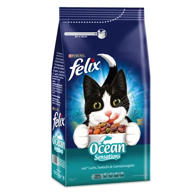 Упаковка корма для кошек Purina Felix Ocean Sensations, виден рисунок кота и надписи: Ocean Sensations, mit Lachs, Seelachs & Gemüsezugabe, масса 2 кг.