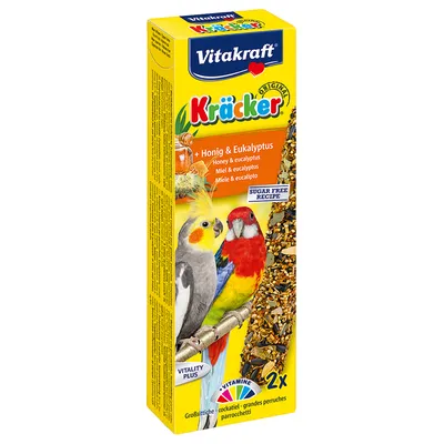 Vitakraft Kräcker Original, miód i eukaliptus, 2x, przysmak dla papug falistych. Widoczne napisy: SUGAR FREE RECIPE, VITALITY PLUS, VITAMINE. Zdjęcie dwóch papug na opakowaniu.