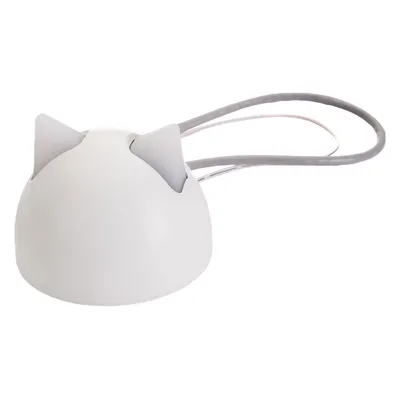 White dome-shaped object with two pointed ear-like features and an attached looped cord, shown on a plain background.