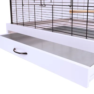 Bird cage with pull-out white drawer and metal handle for easy cleaning. Upper grid structure visible.