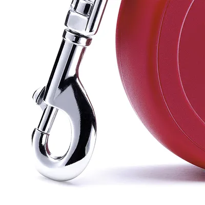 Close-up of a metal clip attached to a red retractable lead, showing the fastening mechanism for secure attachment.
