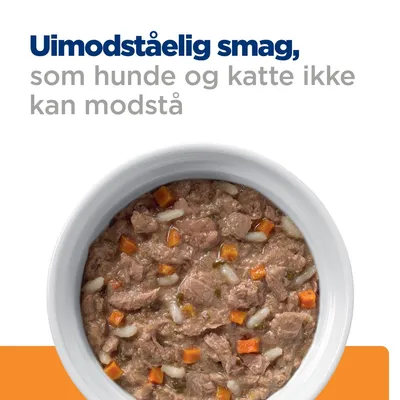 Uimodståelig smag, som hunde og katte ikke kan modstå. Skål med vådfoder, synlige kød- og grøntsagsstykker.