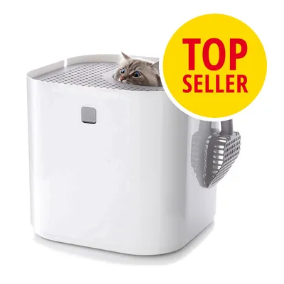 Vit kattlåda med perforerat lock, grå spade på sidan och en katt som tittar upp genom öppningen. Stor gul cirkel med röd text: TOP SELLER.