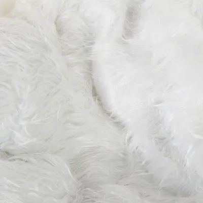 Close-up of white faux fur with a soft, fluffy texture.