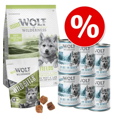 Sada Little Wolf of Wilderness: balení granulí, pamlsků Wild Bites a šest konzerv Blue River. Velký červený symbol procenta označující akční nabídku.