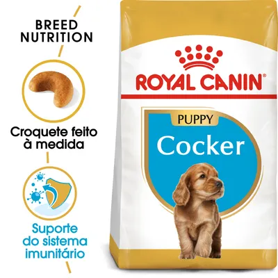 ROYAL CANIN PUPPY Cocker. Croquete feito à medida. Suporte do sistema imunitário. Embalagem de ração para cachorro com imagem de croquete e ícone de escudo. ROYAL CANIN PUPPY Cocker. Croquete feito à medida. Suporte do sistema imunitário. Embalagem de ração para cachorro com imagem de croquete e ícone de escudo.