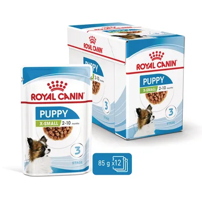 Royal Canin Puppy X-Small 2–10 months, 3 Stage, 85 g x12 annospussia. Pakkauksessa koiran kuva ja tuotetiedot näkyvissä.