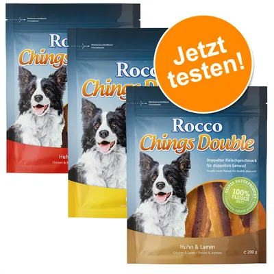 Pungi Rocco Chings Double, vizibil textul: 'Huhn & Lamm', '100% Fleisch', 'Jetzt testen!'. Ambalaj cu imagine câine și fâșii carne. Greutate 200 g.