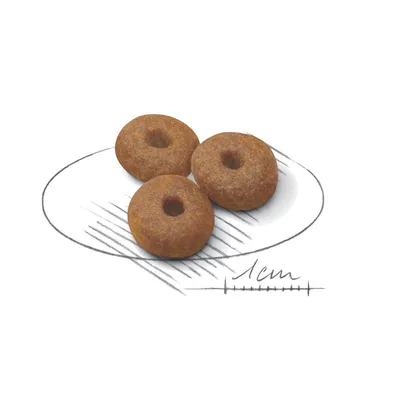 Три кръгли гранули за домашни любимци, показани върху скица с мащаб 1 см за сравнение на размера.