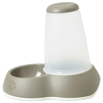 Muovinen lemmikkien automaattinen vesiautomaatti ja ruokakuppi, harmaa-valkoinen, tassunjälkikuvio reunassa. Näkyvissä ei ole tuotemerkkiä tai tekstiä.