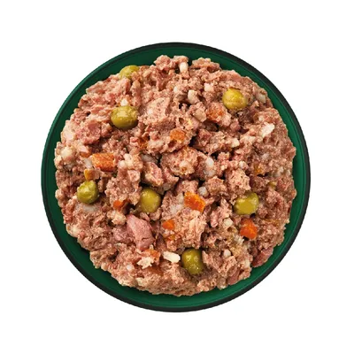 Bowl containing mixed wet food with visible chunks of meat, peas, carrots and rice. Shows texture and ingredients for product selection.
