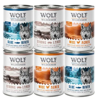 Six cans labelled Wolf of Wilderness with flavours Blue River, Strong Lands, and Wide Acres. Labels show 100% grain-free and ingredients like fish, pork, chicken, wild berries, roots, and herbs.