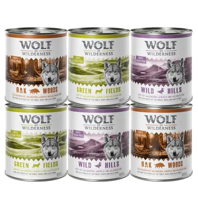 6 puszek Wolf of Wilderness 800 g: Oak Woods, Green Fields, Wild Hills. Widoczne napisy: 100% grain-free. Grafiki wilka i krajobrazów na etykietach.