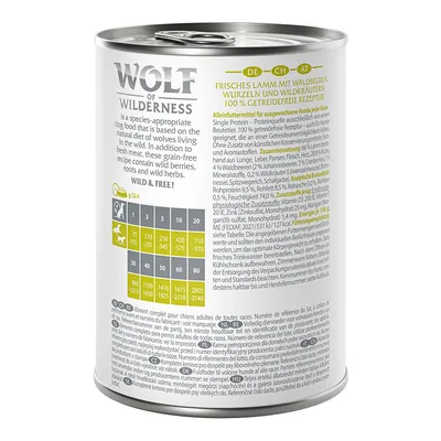 Wolf of Wilderness wet food can. Fresh lamb with forest berries, roots and wild herbs. 100% grain-free recipe. Feeding table for dogs by weight visible.
