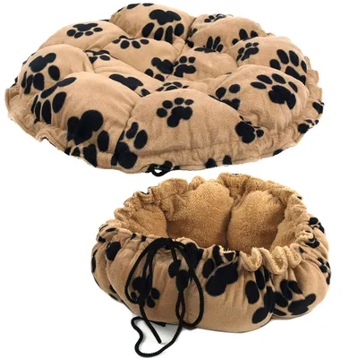 Image shows a round, beige mat with black paw prints that can be used flat or drawn up into a soft nest shape using drawstrings. Image shows a round, beige mat with black paw prints that can be used flat or drawn up into a soft nest shape using drawstrings.