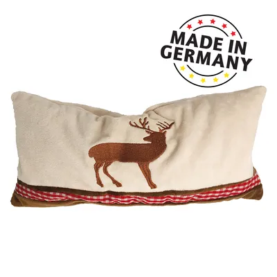 Бежова възглавница с бродиран елен и декоративна лента, надпис MADE IN GERMANY горе вдясно.