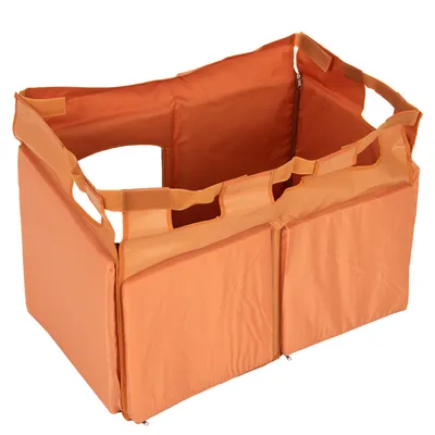 Orange hopfällbar transportbur i tyg med bärhandtag och kardborrstängning, lämplig för husdjur.