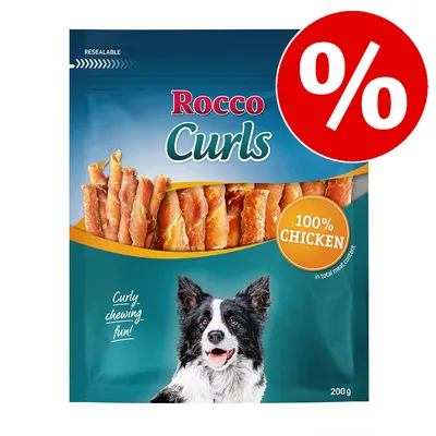 Rocco Curls, 200g, med 100 % kyckling. Återförslutningsbar förpackning. Text: Curly chewing fun! Procenttecken för rabatt synligt.