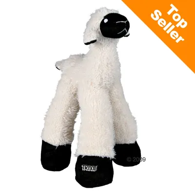 Jouet en peluche blanche en forme de mouton avec pattes noires, marque TRIXIE visible sur une patte. Bande orange en haut à droite avec texte anglais « Top Seller ». Jouet en peluche blanche en forme de mouton avec pattes noires, marque TRIXIE visible sur une patte. Bande orange en haut à droite avec texte anglais « Top Seller ».