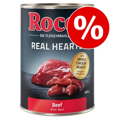 Conservă Rocco Real Hearts Beef 400 g, text vizibil: 'WITH WHOLE CHICKEN HEARTS', etichetă promoțională cu simbol procentual roșu.