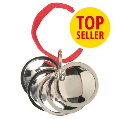 Metallglöckchen mit rotem Band, gelber Kreis mit Text 'Top Seller'. Metallglöckchen mit rotem Band, gelber Kreis mit Text 'Top Seller'.