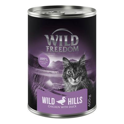 Wild Freedom Wild Hills Chicken with Duck, 24x400g, 100% grain-free recipe. Immagine di una lattina con gatto e paesaggio montano sullo sfondo.