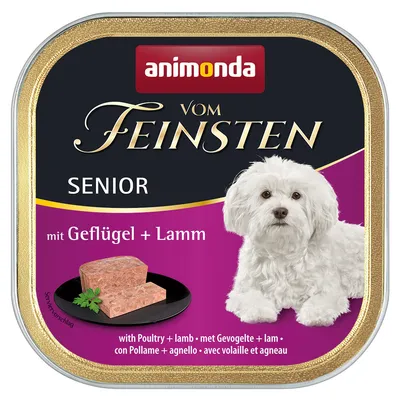 animonda Vom Feinsten Senior mit Geflügel + Lamm, pâtée pour chien senior, avec image d’un petit chien blanc et morceau de pâtée, texte multilingue : avec volaille et agneau