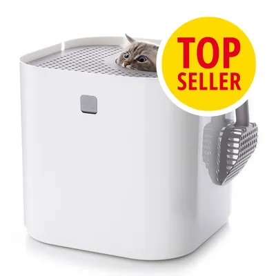 Weiße Katzentoilette mit seitlich befestigter Streuschaufel, Katze schaut oben heraus. Gelber Kreis mit rotem Text: TOP SELLER.