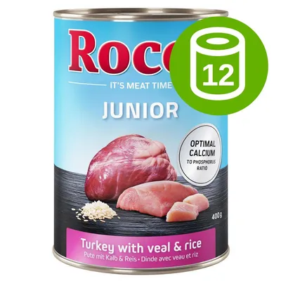 Rocco Junior Turkey with veal & rice, 400 g, optymalny stosunek wapnia do fosforu, zestaw 12 puszek. Widoczne kawałki mięsa i ryżu na etykiecie.