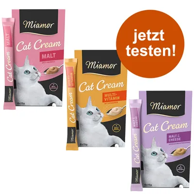 Miamor Cat Cream, trije okusi: Malt, Multi-Vitamin, Malt & Cheese. Na embalaži mačka in besedilo 'jetzt testen!' v oranžnem krogu. Vsaka škatla vsebuje 6×15 g.