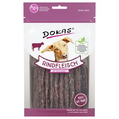 Упаковка Dokas Rindfleisch Getrocknet с изображением собаки, надписью 100% aus Rind и прозрачным окном, через которое видны полоски сушёной говядины.