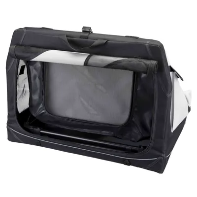 Niche de transport pliable en tissu noir et gris, grande ouverture frontale avec filet, poignée de transport sur le dessus, structure rigide visible à la base.